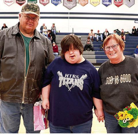 HTRS’ Kellee Snethen (center) pictured with her parents Russ and Roxie Snethen was honored on Parent’s Night for her participation in Unified Bowling this year. Photo courtesy of Lorrie Novak