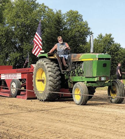 Russ Smith pulls a load with his trusty John Deere Photo courtesy of Courtney Shreve