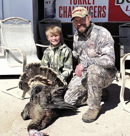 Colton Sedivy (left) and his dad pose with the first bird of Colton’s two birds