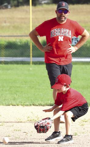 photos by Paula Jasa/Formerly of The Republican/and Trevor Jasa My next photo assignments are going to be of my grandchildren including Walker Jasa (above, inset) and Landon Jasa (above, right) forming their early athletic careers under the tutelage of my son Trevor (above, center). This will coincide with my future fishing endeavors (pictured below) on the family boat at Burchard Lake or on trips to Boston, the golf course, etc. with hubby, Bill!