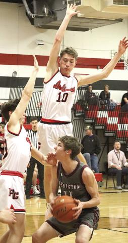 LHS’ Payton Heideman (#11, right) draws a crowd of Pawnee City defenders including Tyler Tegtmeier (left) and Drew Menninga (center, #10). Paula Jasa/Republican
