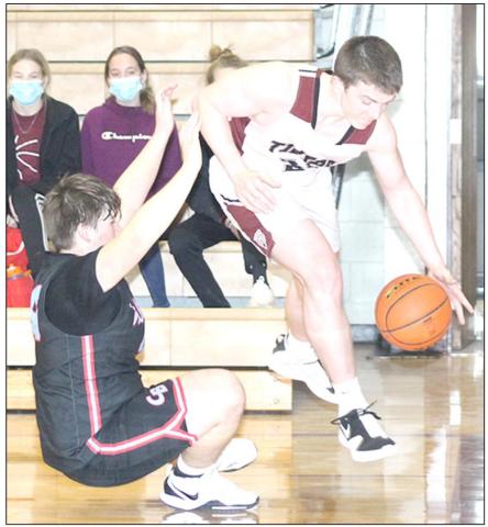 LHS’ Hayden Christen (right) gets fouled driving the baseline against Cedar Bluffs Friday night. Christen led Lewiston with 19 points in the 46-31 victory. Paula Jasa/Republican