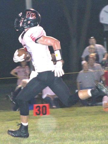 Pawnee City’s Kyle Gyhra scores on a 63 yard touchdown run in the 1st quarter to make it 8-14. Paula Jasa/Republican