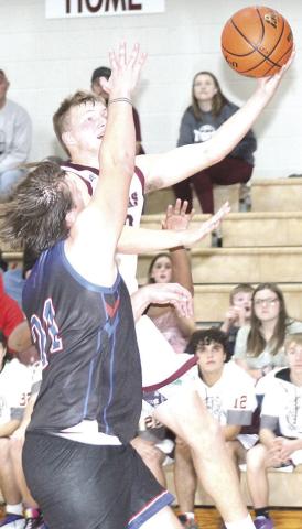 LHS’ Everett Bohling glides in for quick layup as the buzzer sounds at the end of the 3rd period. Bohling led Lewiston with 26 points in their thrilling 66-61 victory. Paula Jasa/Republican