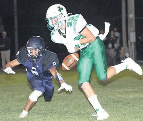 HTRS’ Donovan Kostecka (#2, left) knocks down a PAT pass early in the game. Paula Jasa/Republican