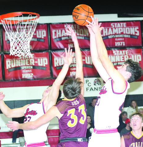 P.C.’s Oscar Machini (#40, right) and Anthony Kling (#23, left) go up for a rebound against Sterling in Friday night’s 59-29 victory over the Jets. Paula Jasa/Republican