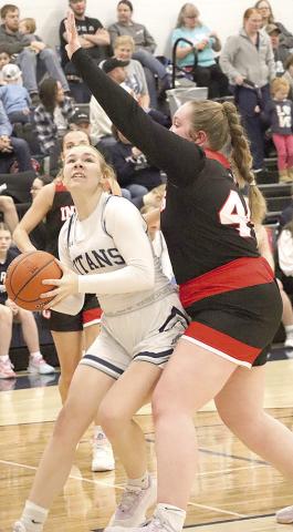 HTRS’ Elie Bstandig (left) goes up for a shot on the baseline against P.C.’s Addy Sisco (#44, right). Paula Jasa/Republican