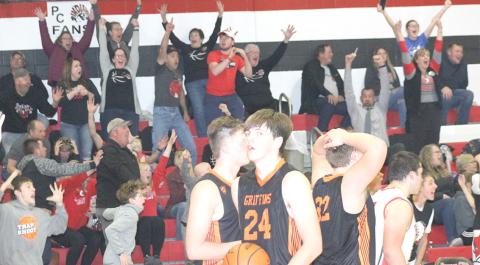Pawnee City fans, bench players and Diller/Odell players react to Pawnee City’s last second three-point shot by Anthony Kling in Thursday night’s home season opener which lifted the Indians to a thrilling 50-49 victory. Paula Jasa/Republican