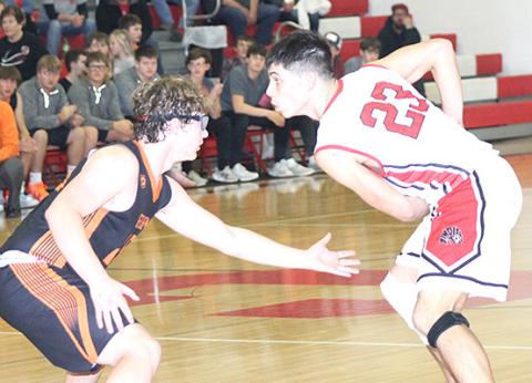 P.C.’s Anthony Kling (#23, right) gets ready to drive the paint against Diller/Odell in Thursday night’s game. Paula Jasa/Republican