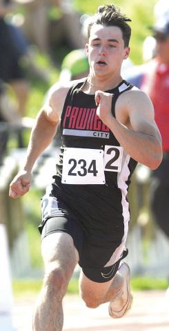 P.C.’s Jett Farwell rounds the corner of the Class D boys’ 400 M. Dash. He placed 6th with a time of 51.95. Photo by Luke Nichols/Beatrice Daily Sun