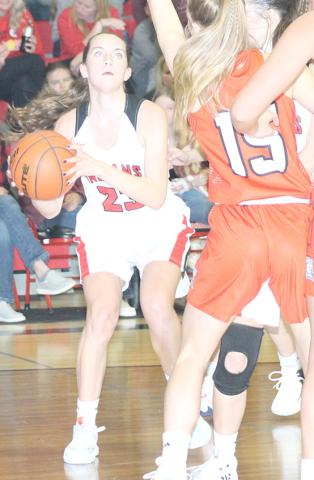P.C.’s Madison Lytle (#23, left) drives the baseline against several D/O defenders. Madison scored 13 poimts against the Lady Griffins on Thursday night. Paula Jasa/Republican