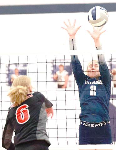 P.C.’s Madelyn Osborne (#6) tries to get a spike past HTRS’ Elie Bstandig (#2, right). Photo courtesy of Lorrie Novak
