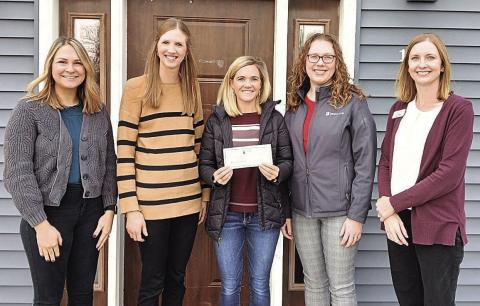 Employees of Sweet Second Home Child Care Center accept a check from State Bank of Table Rock and Community Insurance Group. From left to right: Shelby Barnes, Janae Frase, Amanda Niss, Lisa Laun, Kristen Herrick