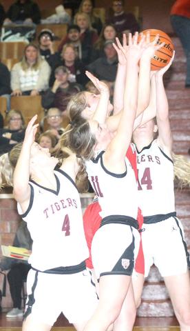 LHS’ Emma deKoning (#4, left) Carleigh Weyers (#11, center) and (Meagan Sanders (#14, right) battle a Meridian player for a rebound early in the Class B Girls’ Mudecas Championship game. LHS had a tough start and lost the game by a 25-41 score. Paula Jasa/Republican