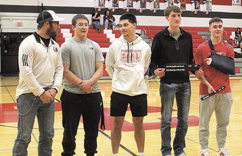 Last spring's 4x100 relay team was recognized for setting a new record time. The award was presented to the team by Ben Blecha, a member of the previous record holding team. Pictured above, from left: Ben Blecha, Jesse McLaughlin, Anthony Kling, Drew Menninga and Jett Farwell