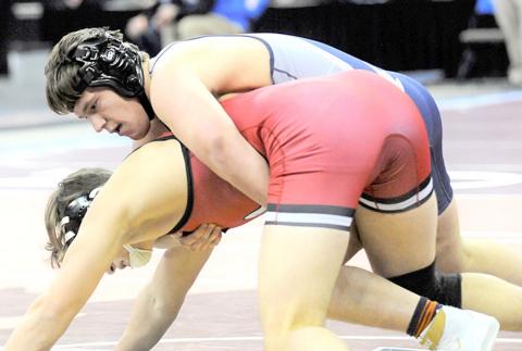 HTRS/P.C.’s Aiden Worthey (on top) takes on one of his competitors in the 195 lb. Division of the Class C State Wrestling Tournament over the weekend. photo courtesy of Luke Nichols/Beatrice Daily Sun