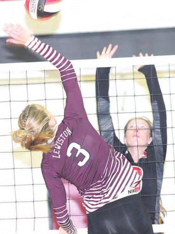LHS’ Katelyn Sanders goes up at the net against P.C.’s Hallye Friedly (#8) in Thursday night’s game. Paula Jasa/Republican