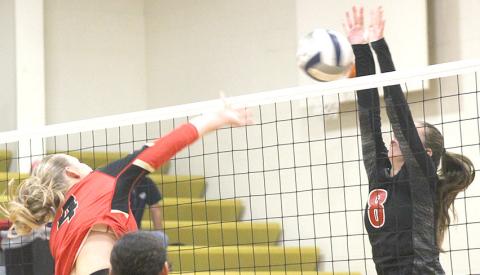P.C.’s Hallye Friedly (#8, right) goes up for a block against a JCC hitter. Paula Jasa/Republican