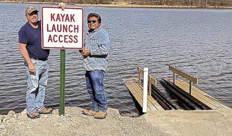 Last week, NRD workers Tomas Chale, Ken Hattun, and Aaron Stalder installed the launch at Iron Horse. On Friday, they returned and Tomas and Ken installed a sign. Photo by Sharla Sitzman