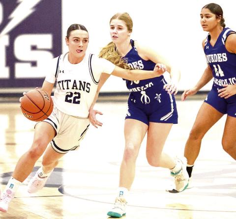 HTRS’ Lillian Bowen (#22, left) drives past two NCL Lady Knight defenders on her way down the floor. Bowen scored 13 points for HTRS in their close 49-54 loss. Photo courtesy of Lorrie Novak