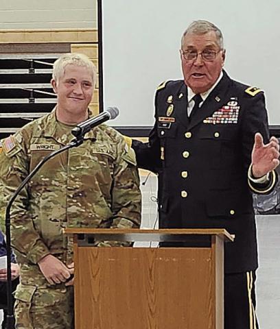 Brody Wright (left) received recognition from Jim Barr (right) at his school's Veterans' Day ceremony last fall