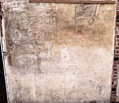 A full view of the back wall of Old Guys Brew where signatures dating back to the late ‘30s can be found