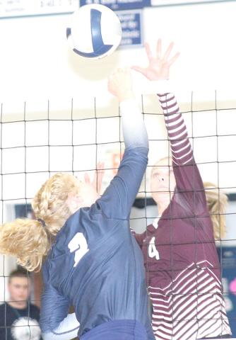 HTRS’ Elie Bstandig (#2, left) and Lewiston’s Emma deKoning (#4, right) go up strong at the net. Paula Jasa/Republican