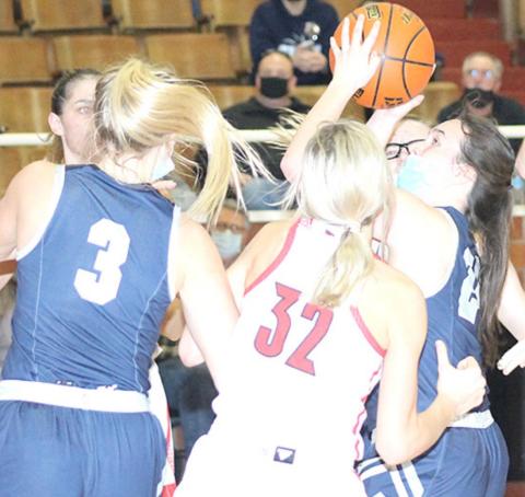 HTRS’ Tara Zimmerling (#24, right) puts up a shot against Wymore Southern as teammate Katilyn Glathar (#3, left) looks to help out or rebound. Paula Jasa/Republican