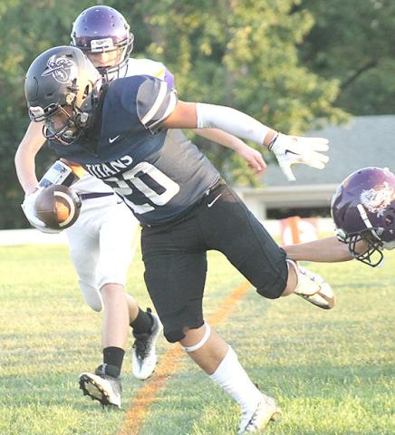 HTRS’ Alex Koziol (#20) scores on a touchdown early in the game for the Titans. Paula Jasa/Republican