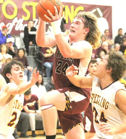 LHS’ Tristen Ray (#24) makes a strong move to the hoop against Sterling on Friday night. Ray scored 10 points against the Jets in their 47-61 loss. Paula Jasa/Republican