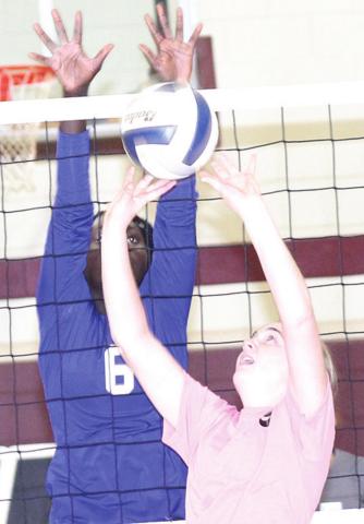 LHS’ Carleigh Weyers (#9, right) goes up for a tip/set at the net. Weyers had several tips at the net. Paula Jasa/Republican