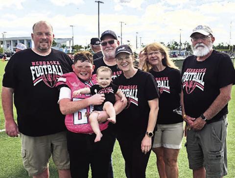 Left to right: Tanner Hatfield, Jackson Hatfield, Quinley Hatfield, Marvin Blecha, Dani Hatfield, Candy Blecha, and Charlie Hatfield pose for a family photo in Naples, Florida, during the Football University National Championships. Jackson, an 11-year-old fifth grader, competed as a member of the FBU Nebraska 10U All-Star Team.