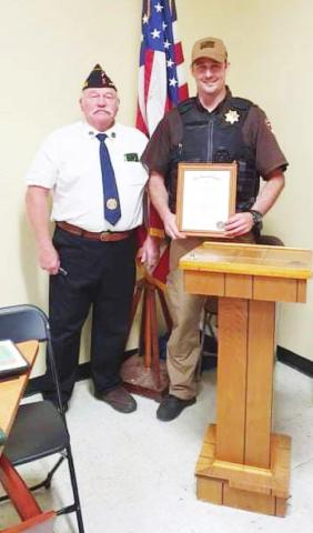 Sheriff Braden Lang received a Certificate of Law Enforcement Commendation from Brown Hays Post 289 presented by Gregg Clement. The award was made at Shirley’s on Veterans Day.