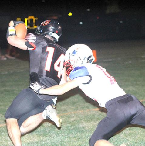 P.C.’s Jett Farwell (#14) eludes a Parkview Christian tackler on his way to the end zone Friday night. Farwell scored all three of Pawnee City’s touchdowns. Paula Jasa/Republican