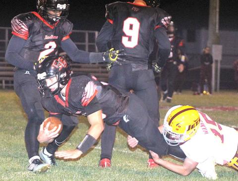 P.C.’s Philip Layne (#3, center) stretches for some extra yardage before halftime against Sterling on Friday night. Also pictured are Atreyu Kling (#2, left) and Jesse McLaughlin (#9). Pawnee City took care of Sterling by a 44-13 score. Paula Jasa/Republican