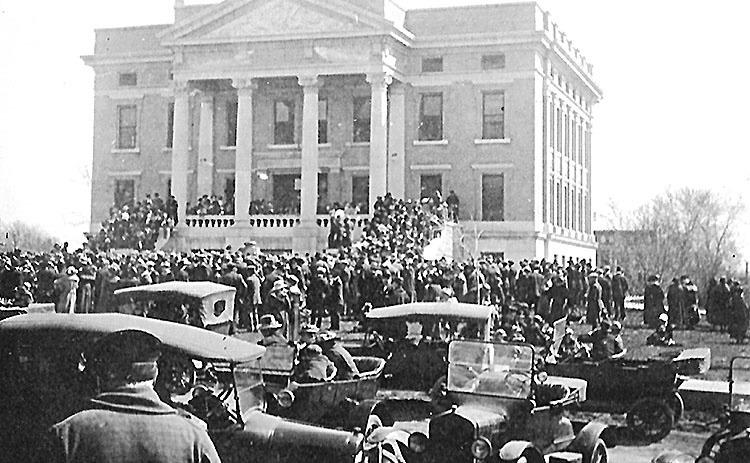 The Pawnee County Courthouse on November 11, 1918 as citizens gathered to celebrate Armistice Day, the conclusion of World War I. Construction of the courthouse had begun in 1911 and completed by 1912. The building was still very new. Photo by Archer King, courtesy of Table Rock Historical Society.