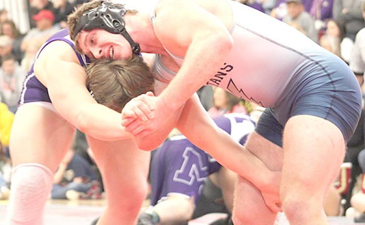 HTRS/P.C.’s Andy Maloley (right) battles against a Milford wrestler in the semifinals at Fairbury last Friday. photo courtesy of Jamie Maloley