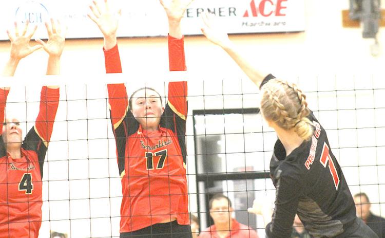 Pawnee City’s Adrian deKoning (#7, right) powers a spike past two JCC defenders in Thursday night’s game. Paula Jasa/Republican