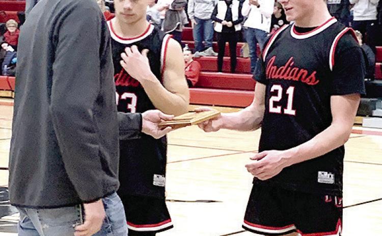 Paula Jasa/Republican PAWNEE CITY AT PIONEER – Pawnee City’s Trey Marteney (#21, right) and Anthony Kling (#23, left) accept the 4th place Pioneer Conference Basketball plaque on Saturday. See page 5 for story.