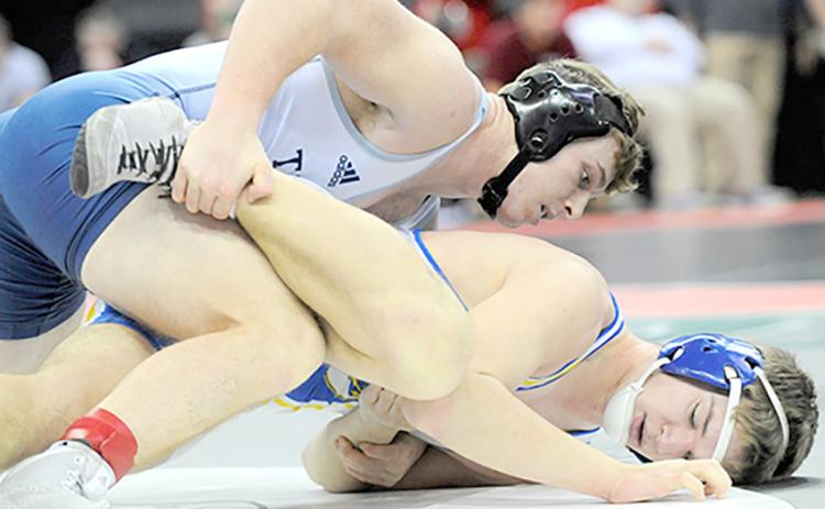 HTRS/P.C.’s Andy Maloley (left, on top) takes down Tri-County’s Cael Washburn at the State Wrestling Tournament on Friday. Maloley won by an 8-0 Major Decision. photo provided by Luke Nichols/Beatrice Daily Sun