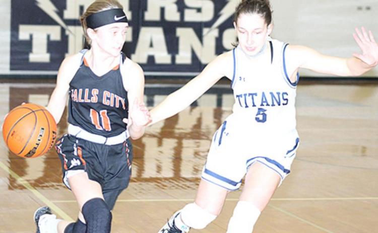 HTRS’ Ellie Schaardt (#5, right) defends against a Falls City player in Thursday night’s game. Paula Jasa/Republican