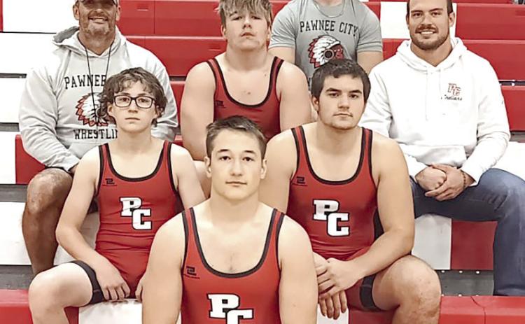 Members of the 2024-25 Pawnee City Wrestling Team are front: Jesse McLaughlin. Second row: Luke Hunzeker and Dylan Layne. Third row: Head Coach Shane Maloley, Gauge Schuetz, Coach Josh Andreasen. Back row: Coach Andy Maloley.