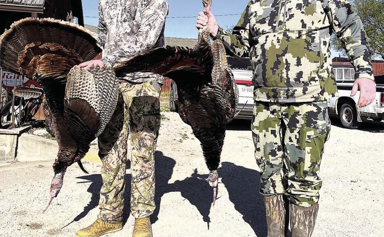 Adult division third place finisher Casey Henry (right) with son Bo Henry (left)