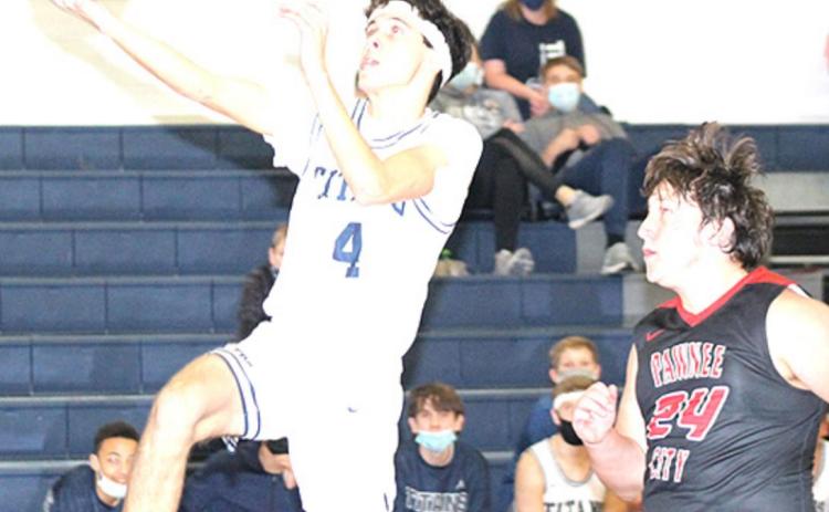 HTRS’ Nic Knudson (#4) scores on one of his many steals and layups in the game against Pawnee City. Knudson poured in 34 points to lead the Titans to victory. Paula Jasa/Republican