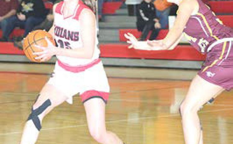 P.C.’s Hallye Friedly (#15, left) works the ball around the top of the key against the Sterling Lady Jets. Paula Jasa/Republican