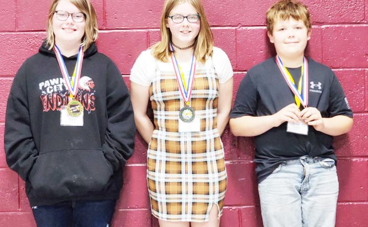 3rd/4th Grade Division: (l to r) Landon Rohmeyer, Lewiston, 2nd place, Abigail Johnson, Pawnee City, 3rd place, Chloe Bogues, Lewiston, 1st place