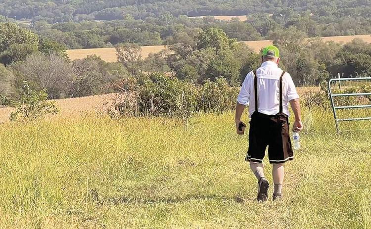 The Uplands of Sheridan Township were the star of the 2026 Volksmarch held by the Rock Country School Foundation last weekend. They form the rim of the Nemaha River Valley. Here, Howard Blecha hikes the last long downhill slope.