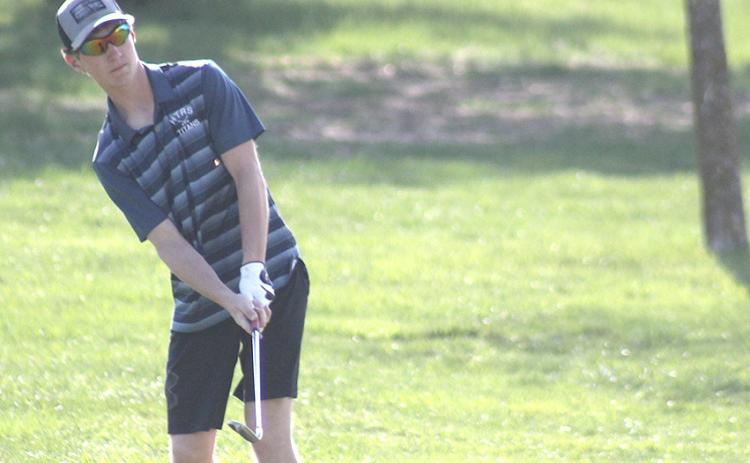 HTRS/P.C.’s Justin Pierce watches as he chips his shot into the hole on the #4 green last Thursday at the JCC Invitational. Paula Jasa/Republican