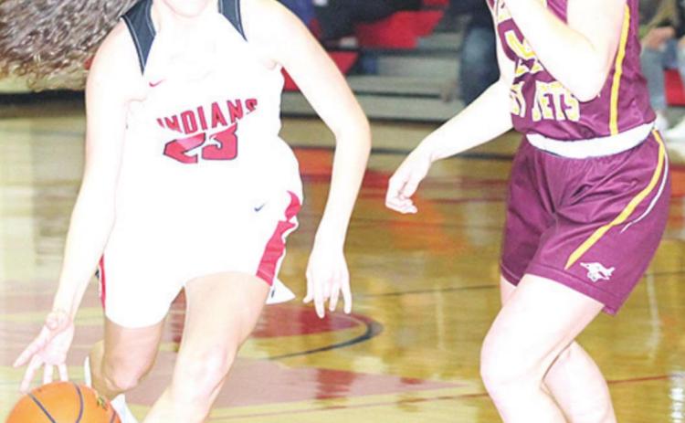 P.C.’s Madison Lytle (#23, left) drives the lane against Sterling in last Friday night’s matchup. Paula Jasa/Republican