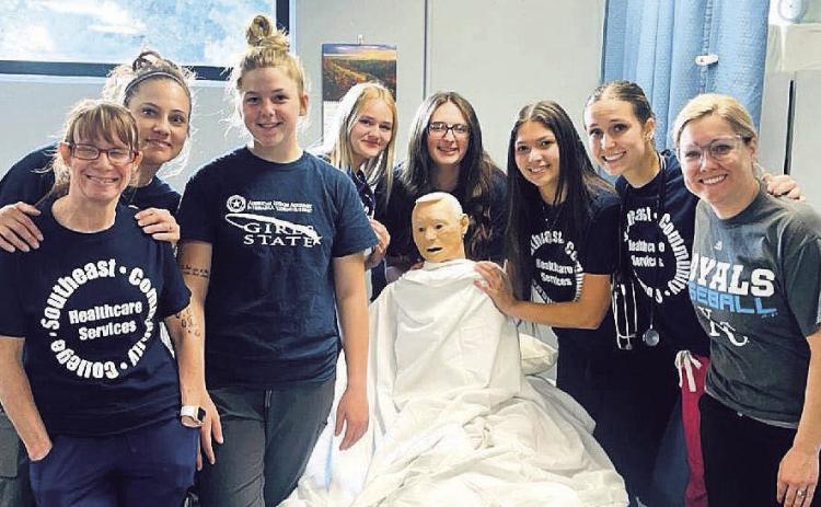 Pictured are students: Jenny Ouding, Leann Johnson, Delayne Currie, Anna Meints, Riley Hock, Naomi Rodriquez, Logan Maloley, and Instructor Kelsey Johnson, RN.